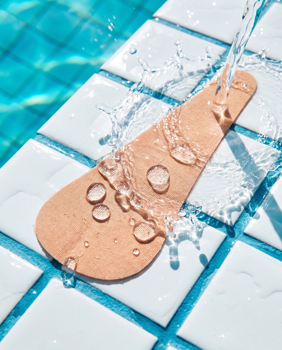 Water beading on a Swim Shell stuck to pool tiles